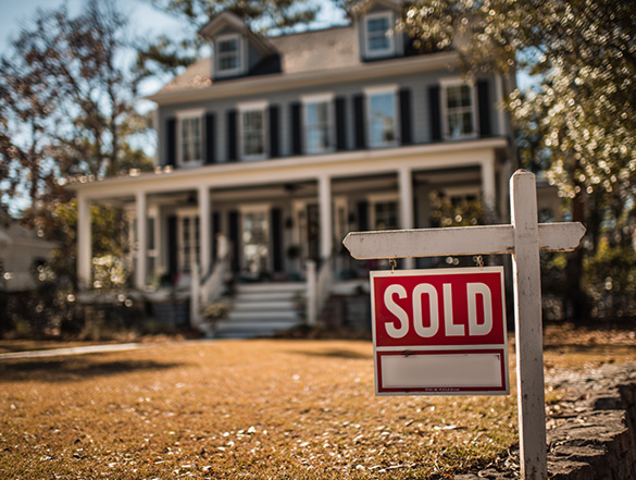 Home with a sold sign in the front