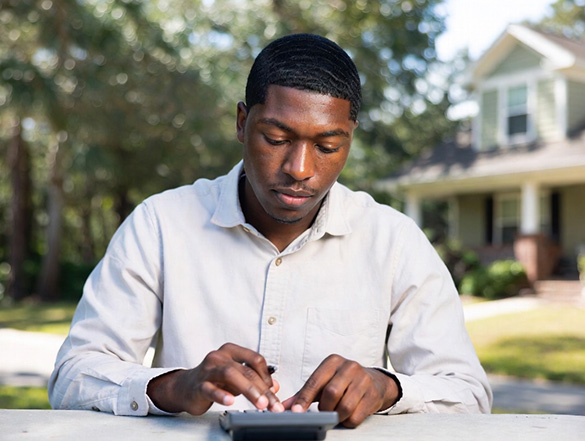a man trying to calculate Closing cost for refinancing a mortgage